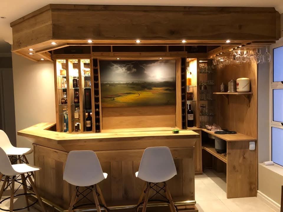 Built-in solid oak home bar with wine storage and integrated lighting