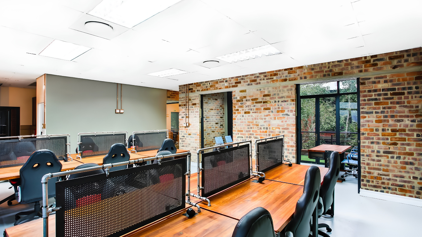Commercial office fit-out with hardwood workstations and steel detailing